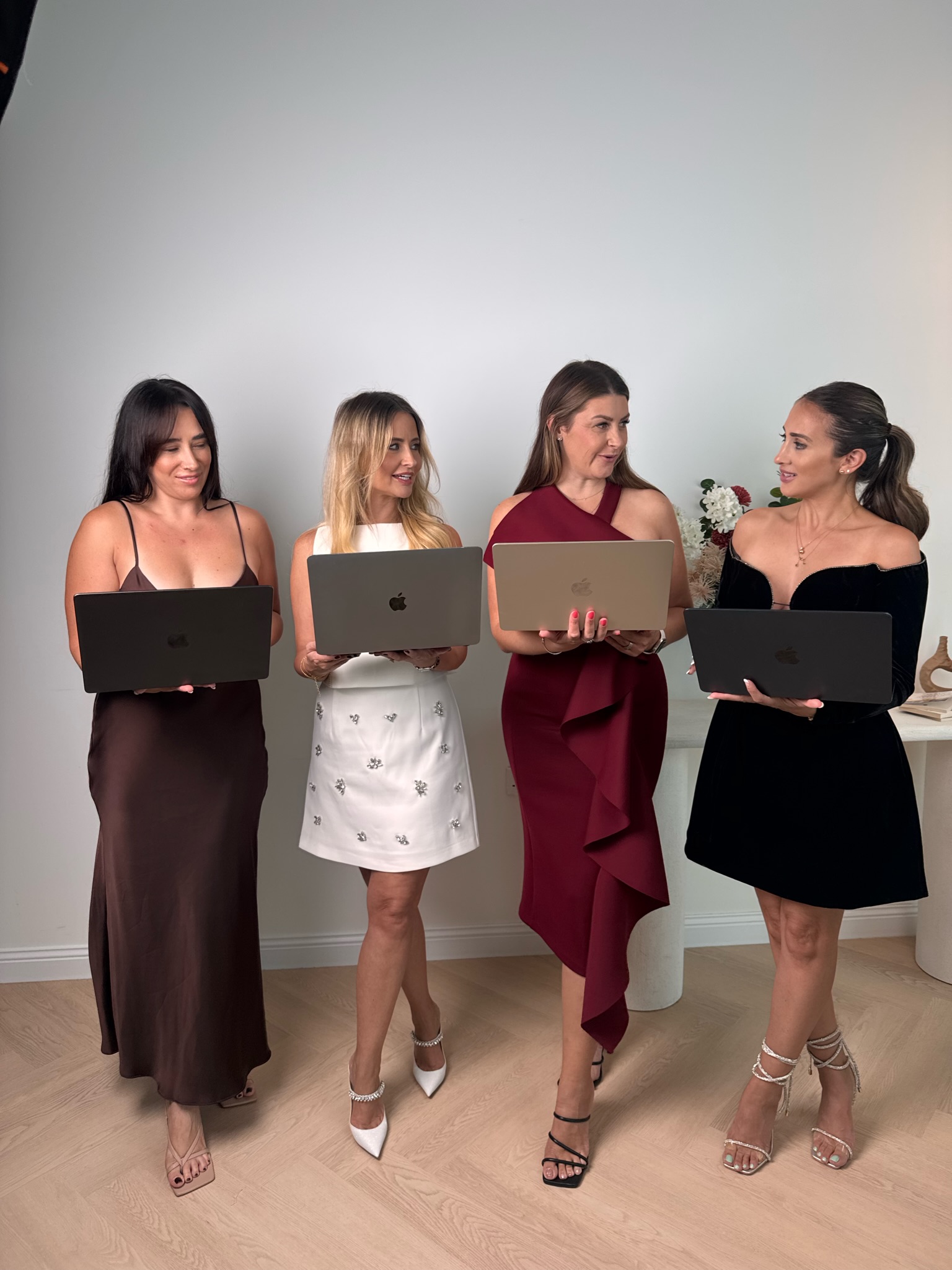 Team members with laptops dressed up