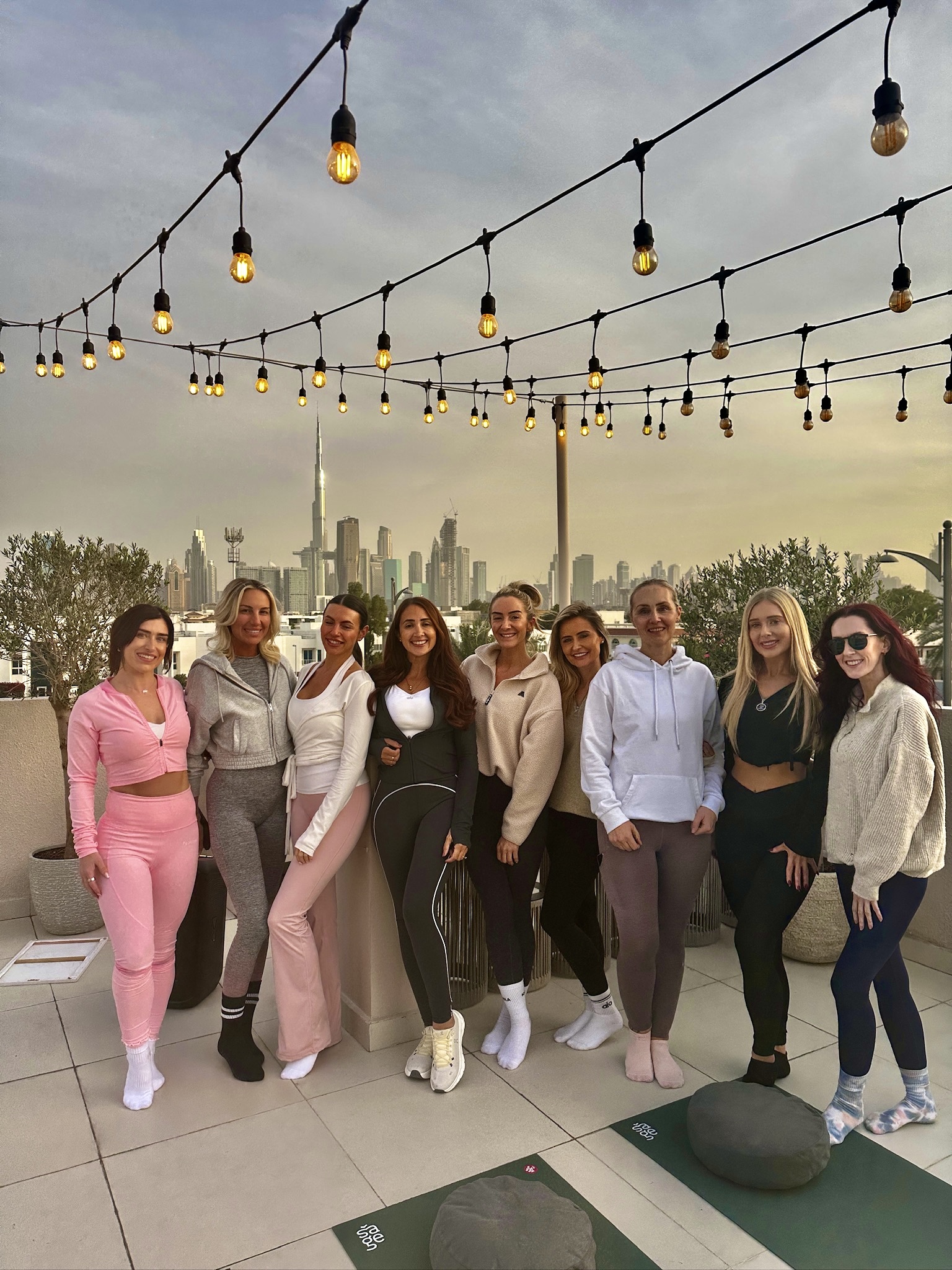Team on a Dubai rooftop at sunset